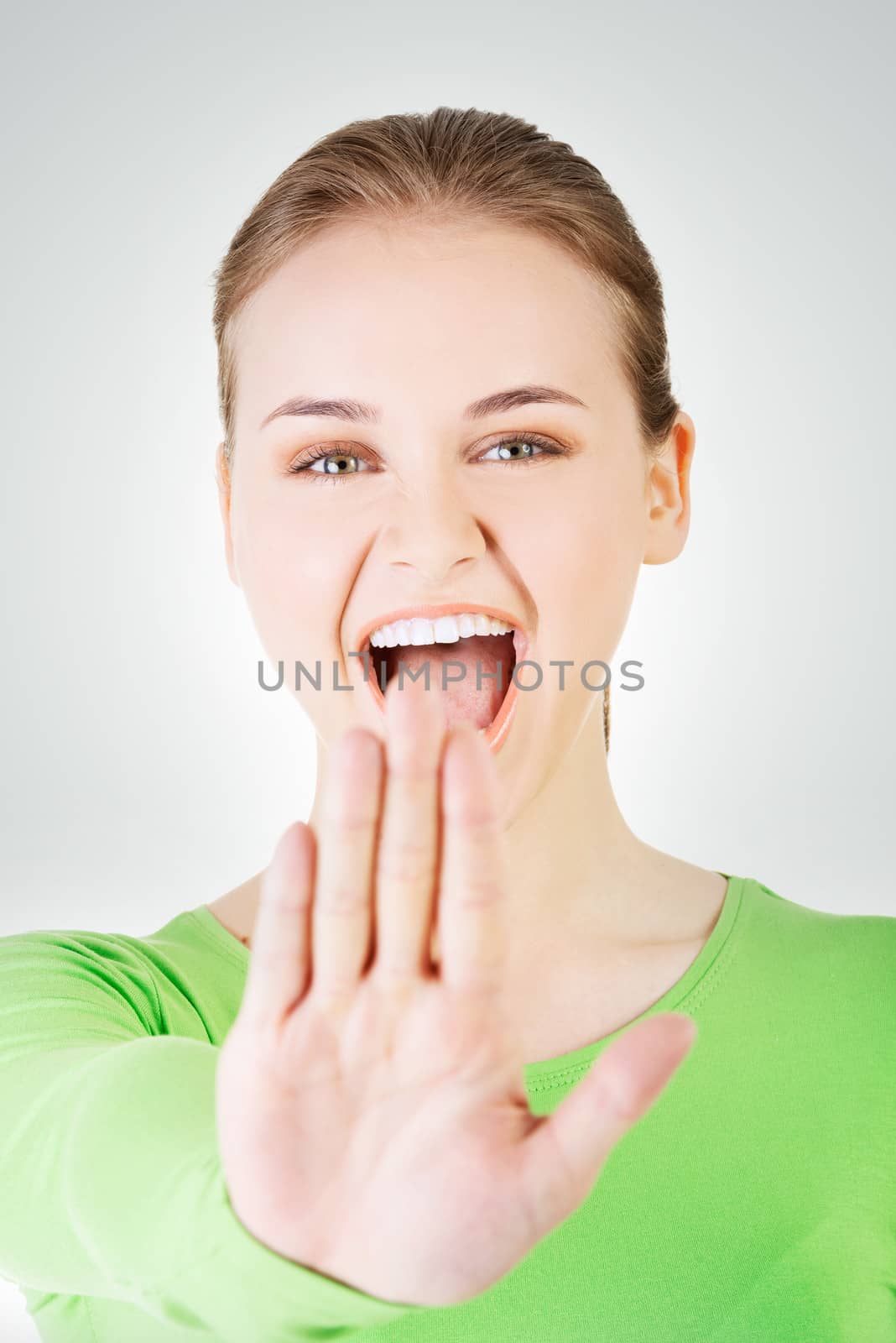 Hold on, Stop gesture showed by young woman