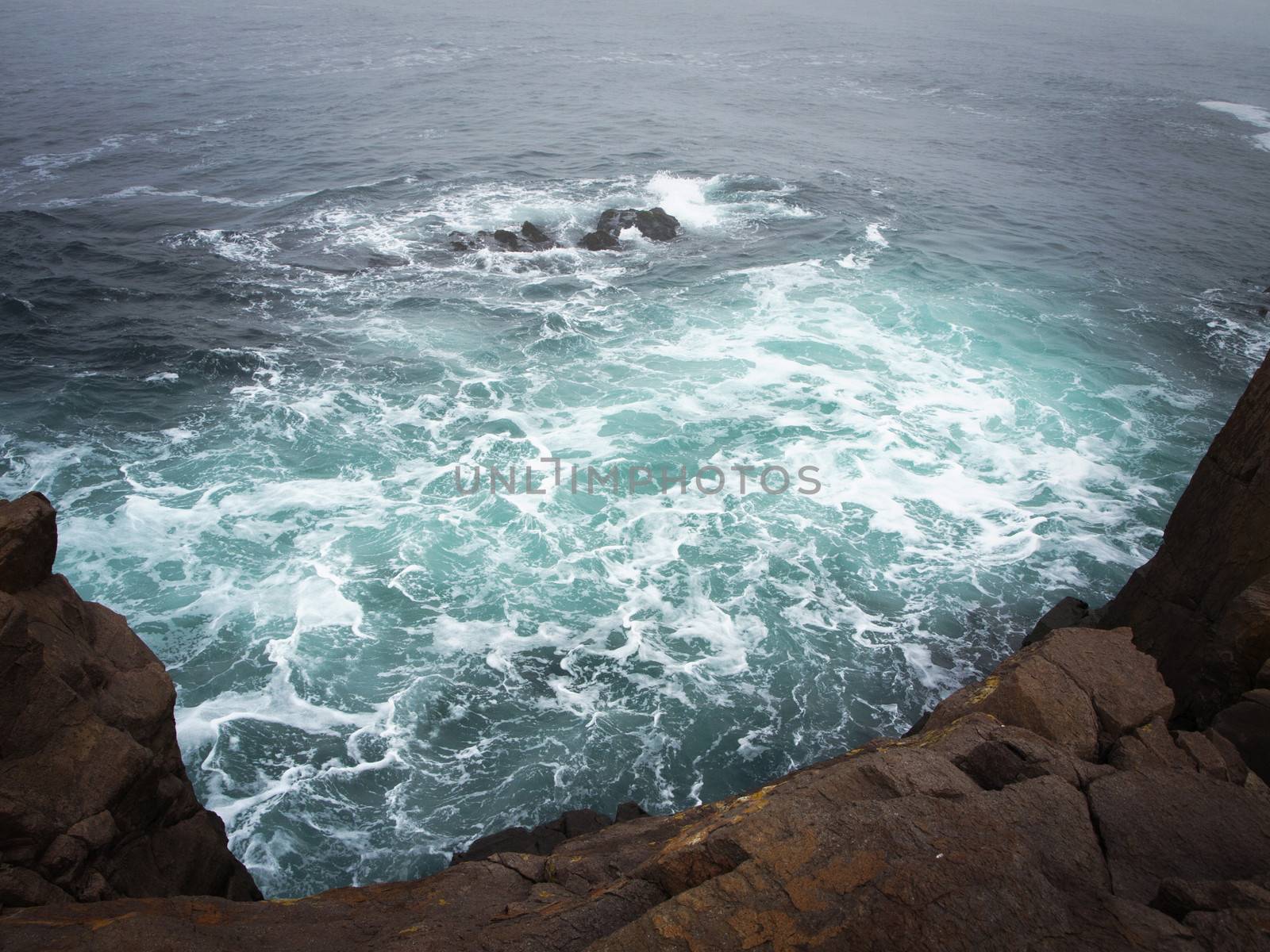 Storm Sea With Dark Rocks in Bad Weather Time