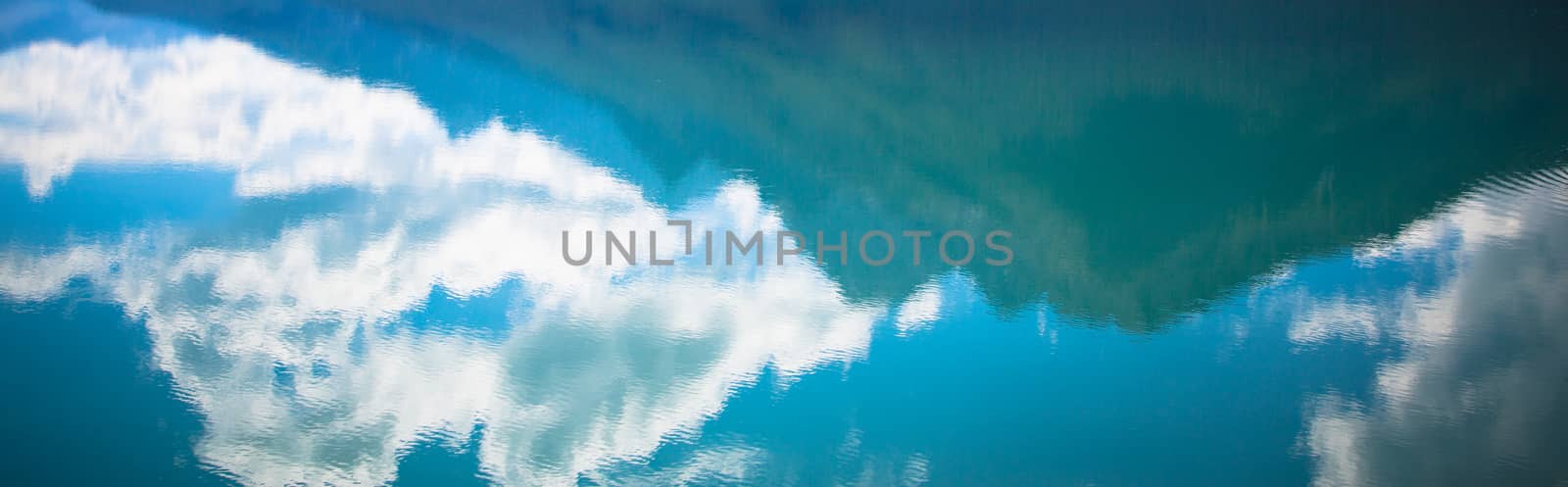 mountains clouds and sky; water reflection