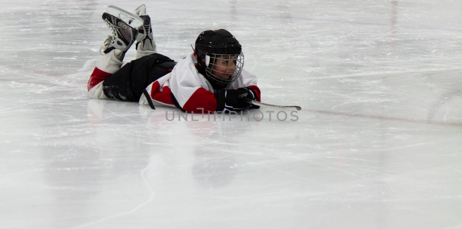 Child playing ice hockey