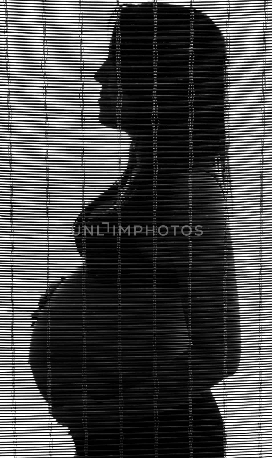 Pregnant woman in shadow with curtain effect