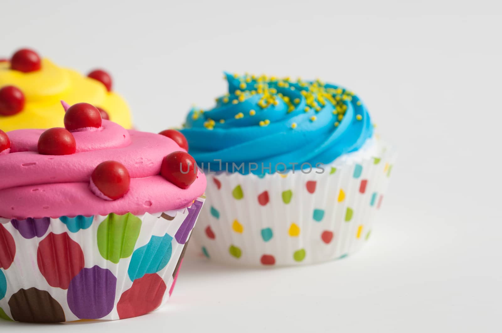 Colorful decorated cupcakes closeup