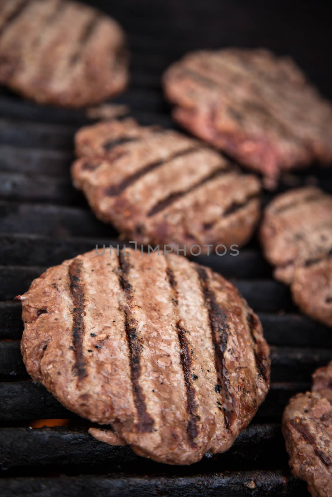Hamburgers cooking on the BBQ grill