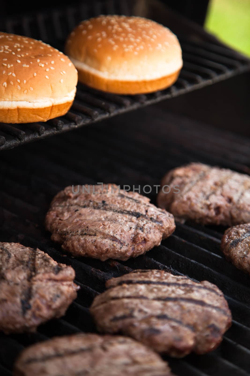 Hamburgers cooking on the BBQ grill