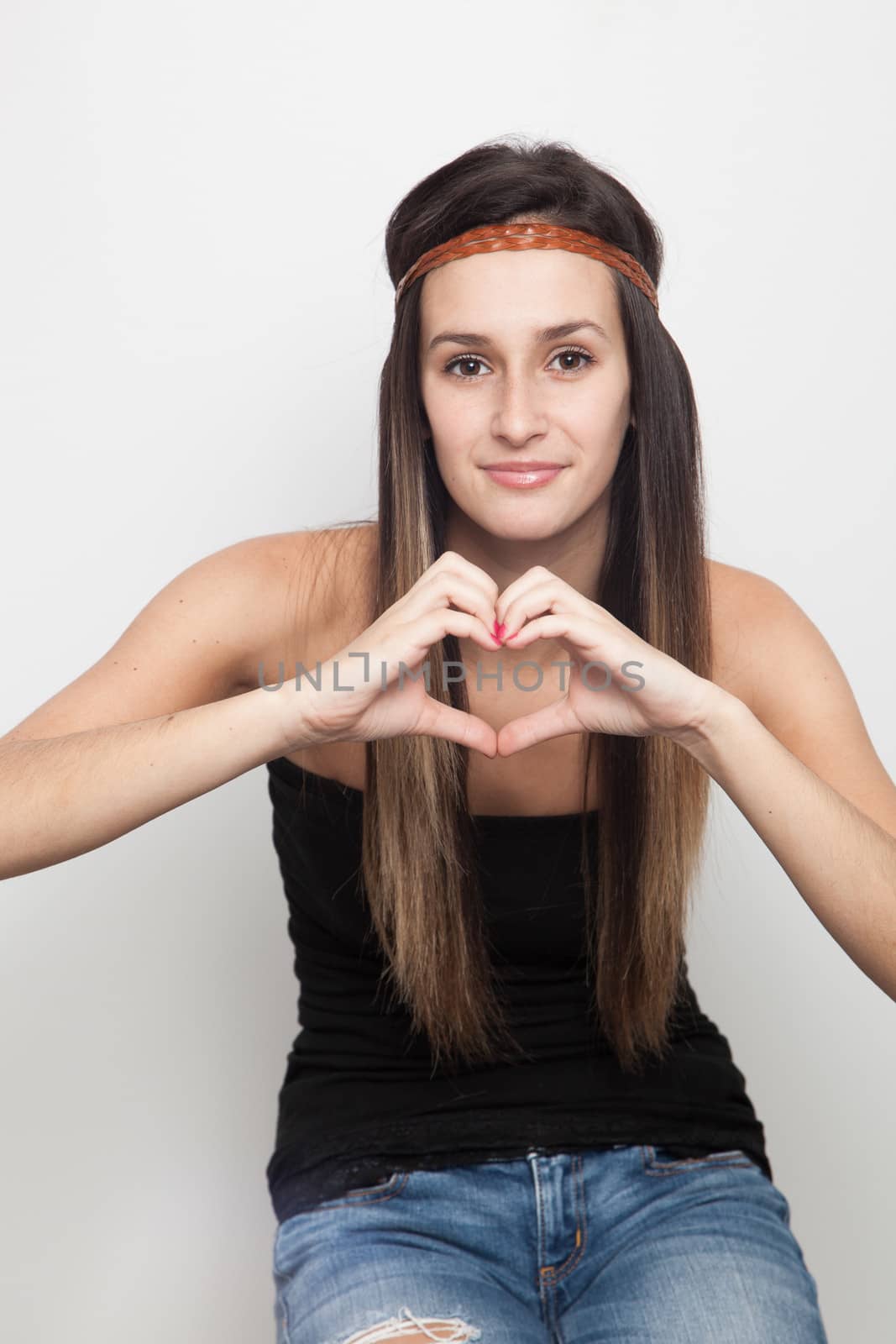 Young caucasian brunette woman on a white background