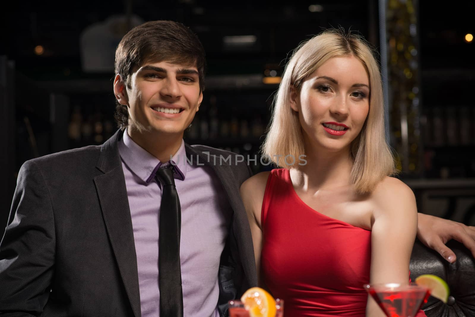 Young couple talking in a nightclub by adam121