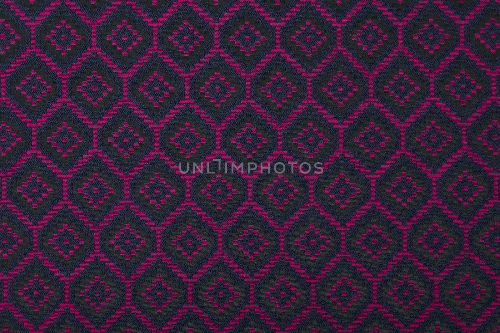 Material in geometric patterns, a colored textile background.