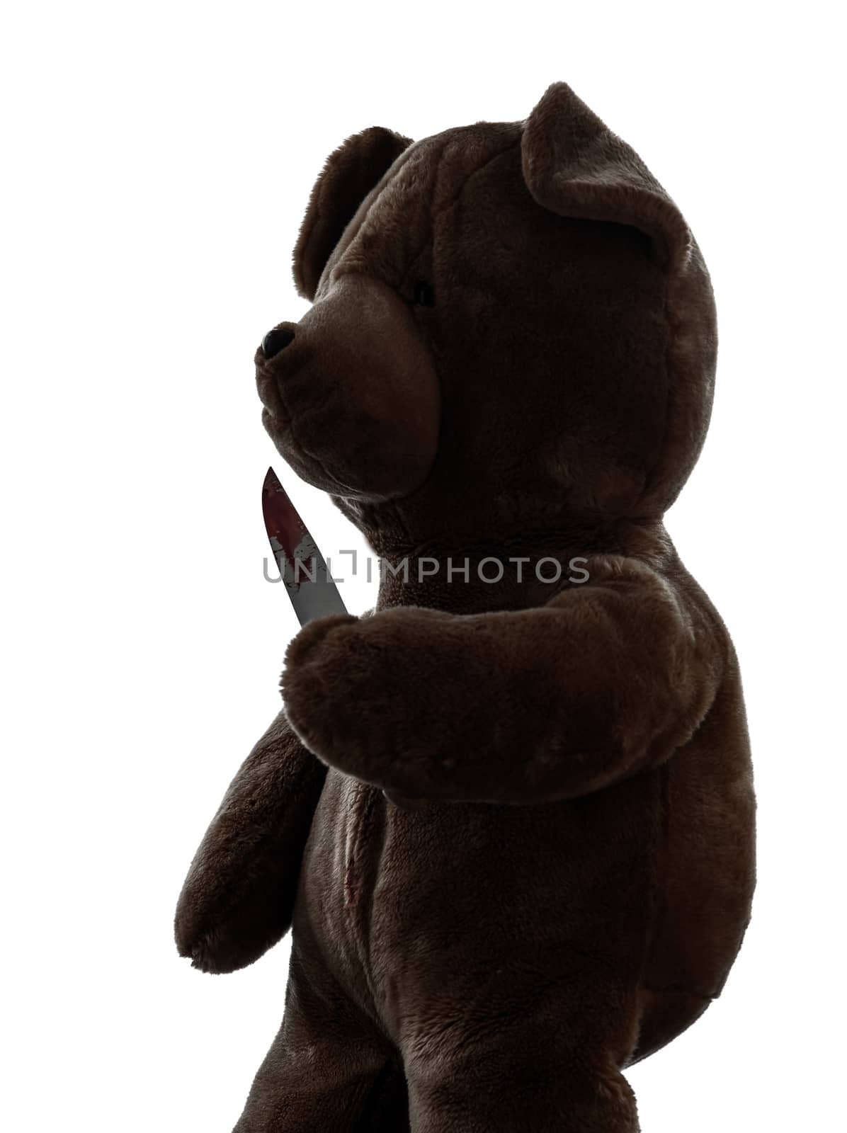 one strange killer teddy bear holding bloody knife in silhouette white background