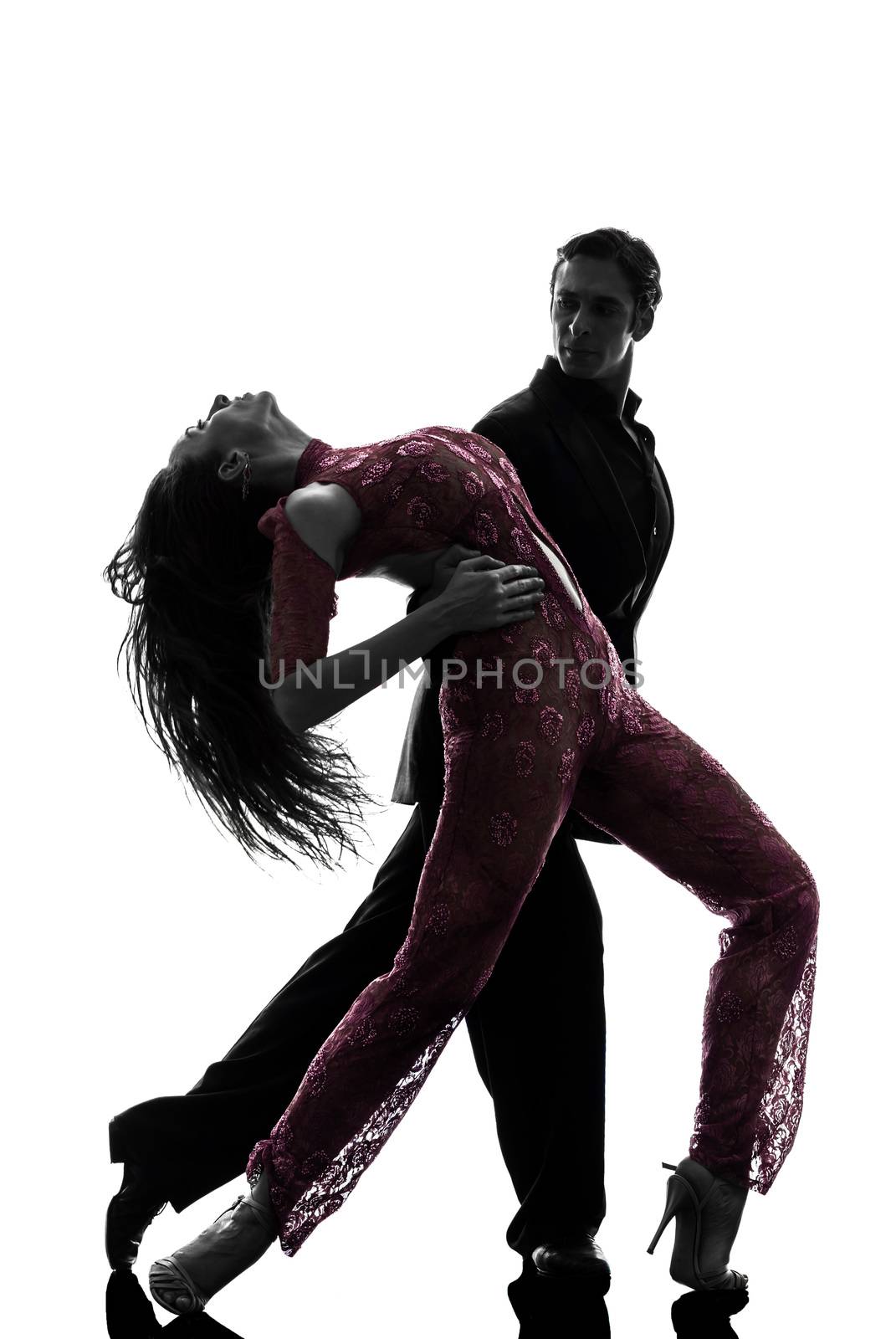 one caucasian couple man woman ballroom dancers tangoing in silhouette studio isolated on white background