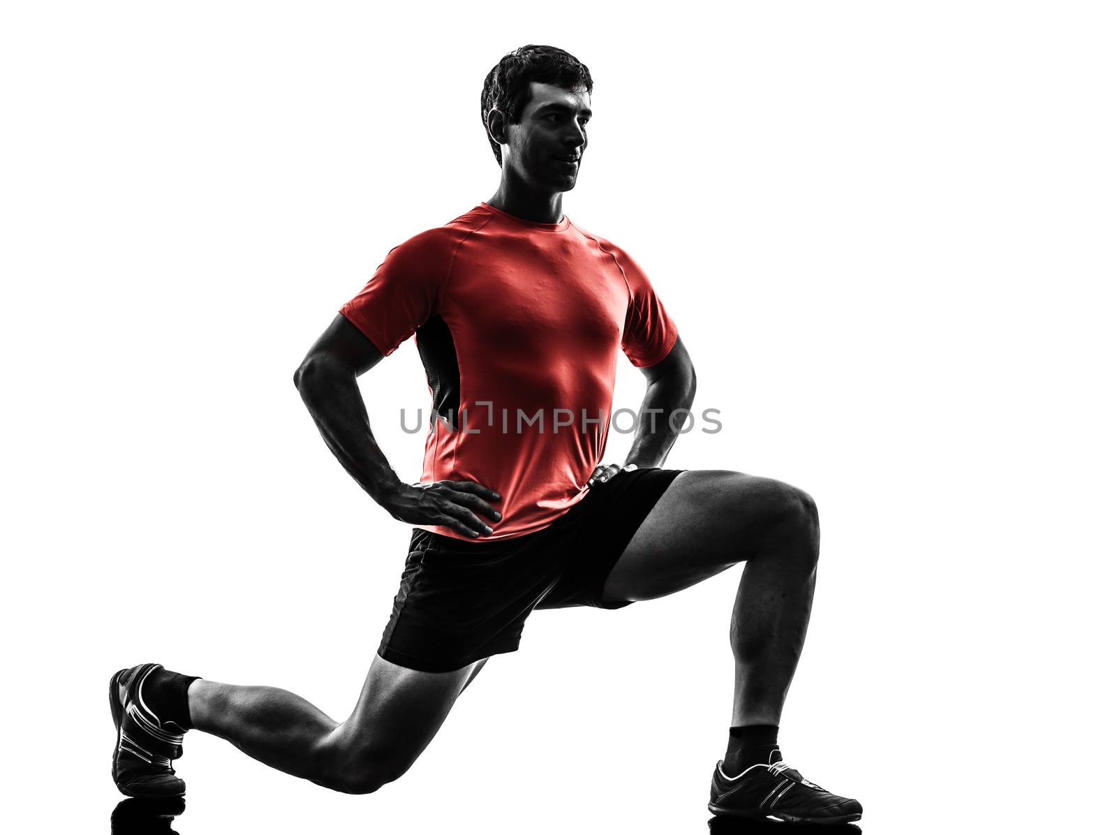 one man exercising fitness workout lunges crouching in silhouette on white background