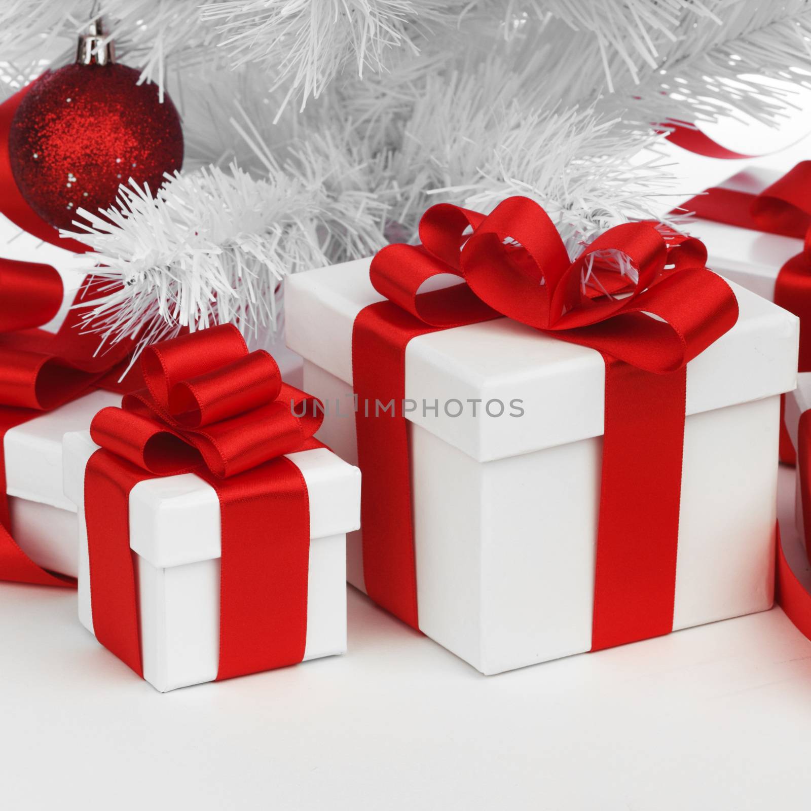 Christmas tree and gifts isolated on white background