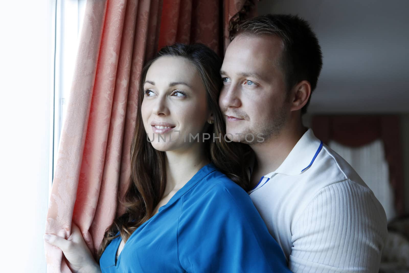Happy beautiful woman with his husband at home