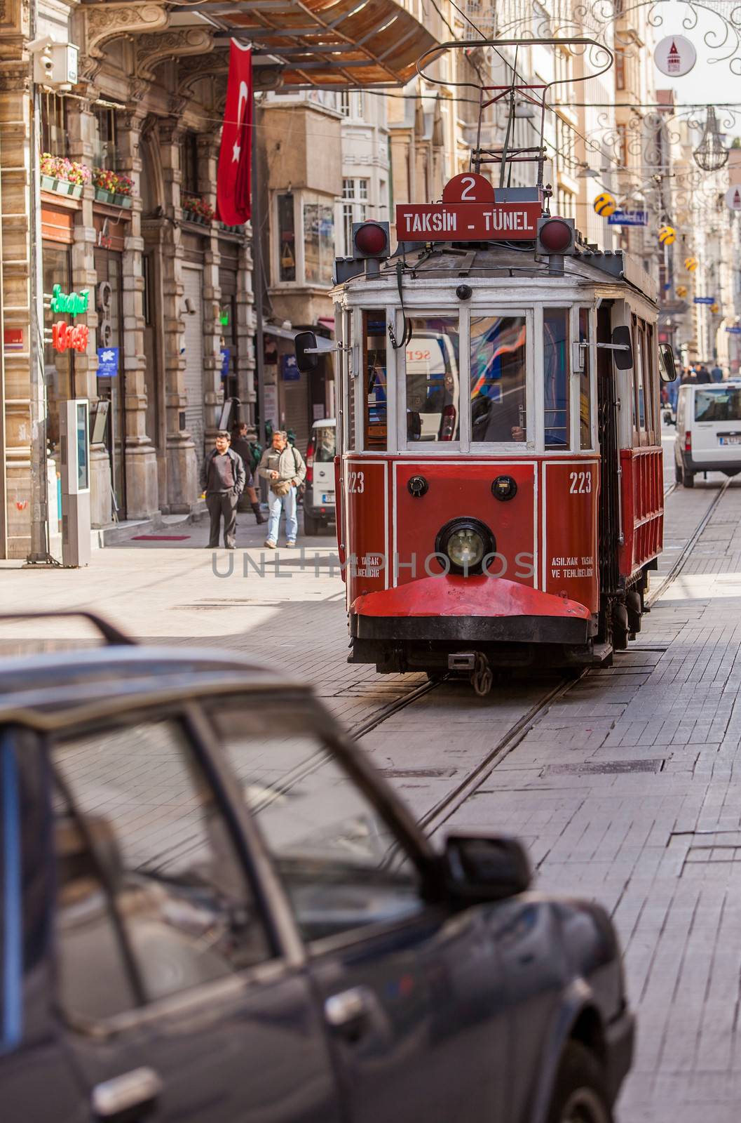 ISTANBUL, TURKEY ��� APRIL 28: Trolley car on busy street on April 28, 2012 in Istanbul, Turkey.  Each year patriotic Turks honor those fallen at the battle of Galipoli during World War I.