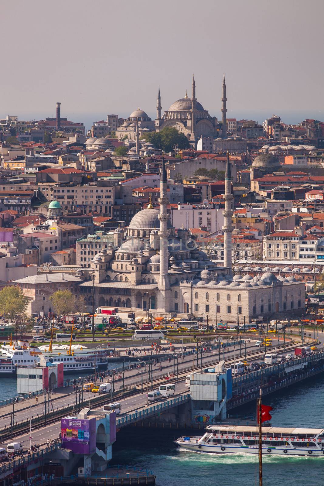 ISTANBUL, TURKEY ��� APRIL 28: The New Mosque and neighborhoods along the Bosphorus on April 28, 2012 in Istanbul, Turkey prior to Anzac Day.  The Bosphorus divides Turkey between Europe and Asia.  