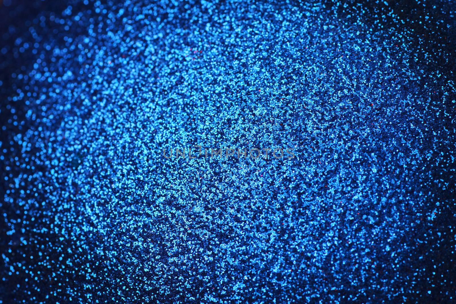 Blue metallic sparkling background with vignetting