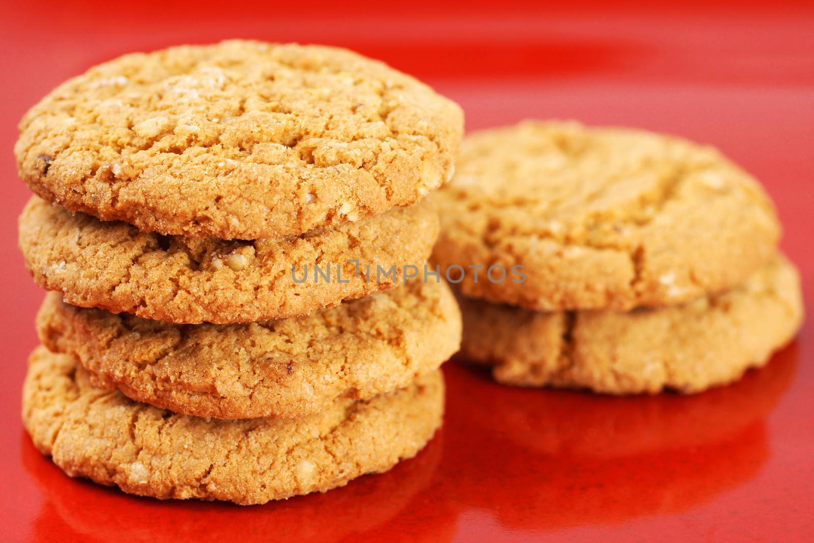 Oatmeal cookies on red plate by Mirage3