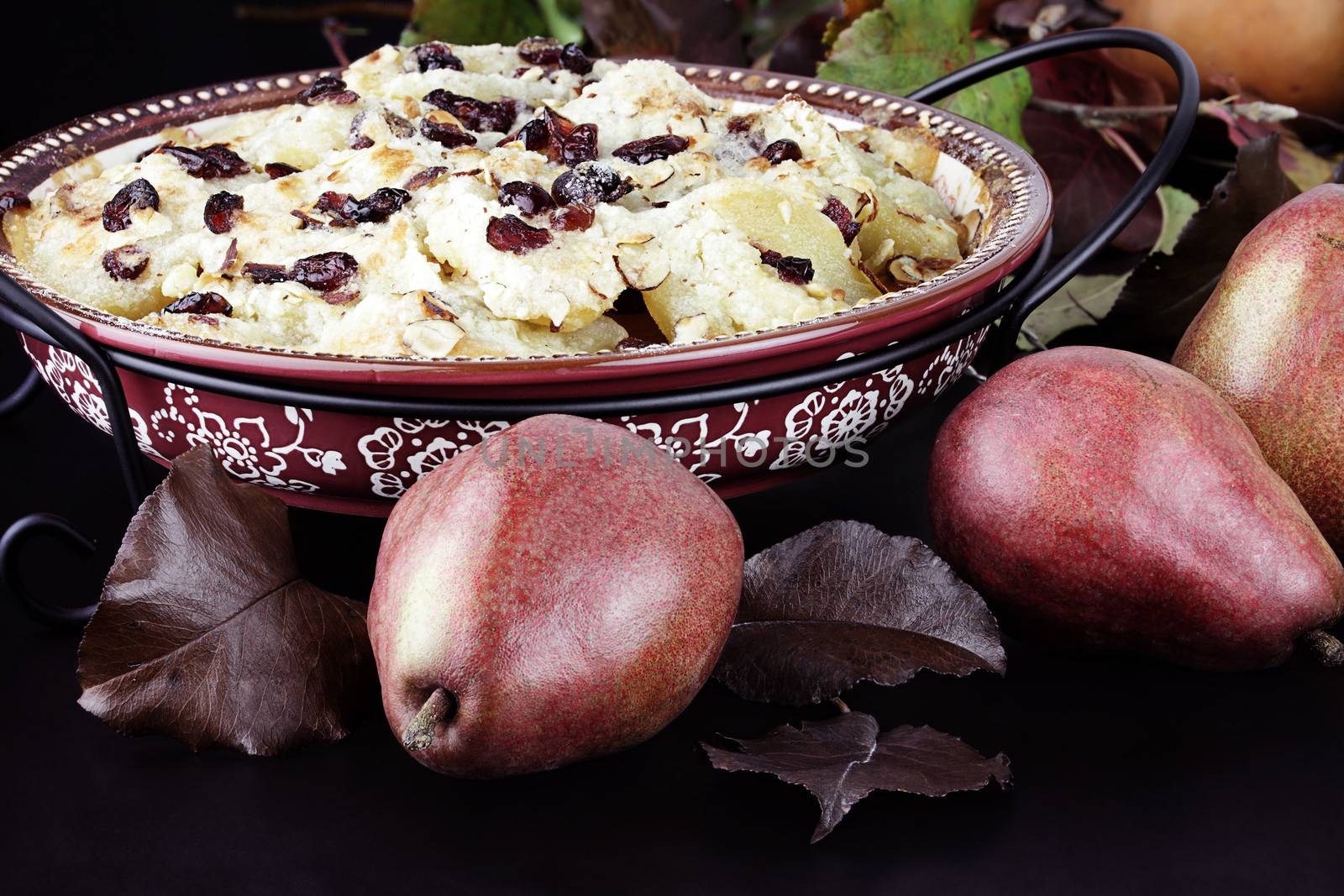 Pear crisp made with cranberries and almonds and fresh pears.