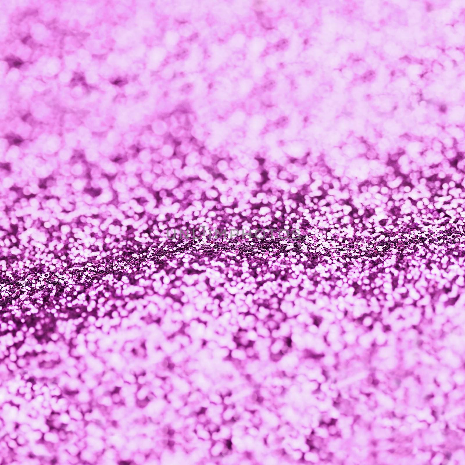 Abstract purple glitter background with copy space.