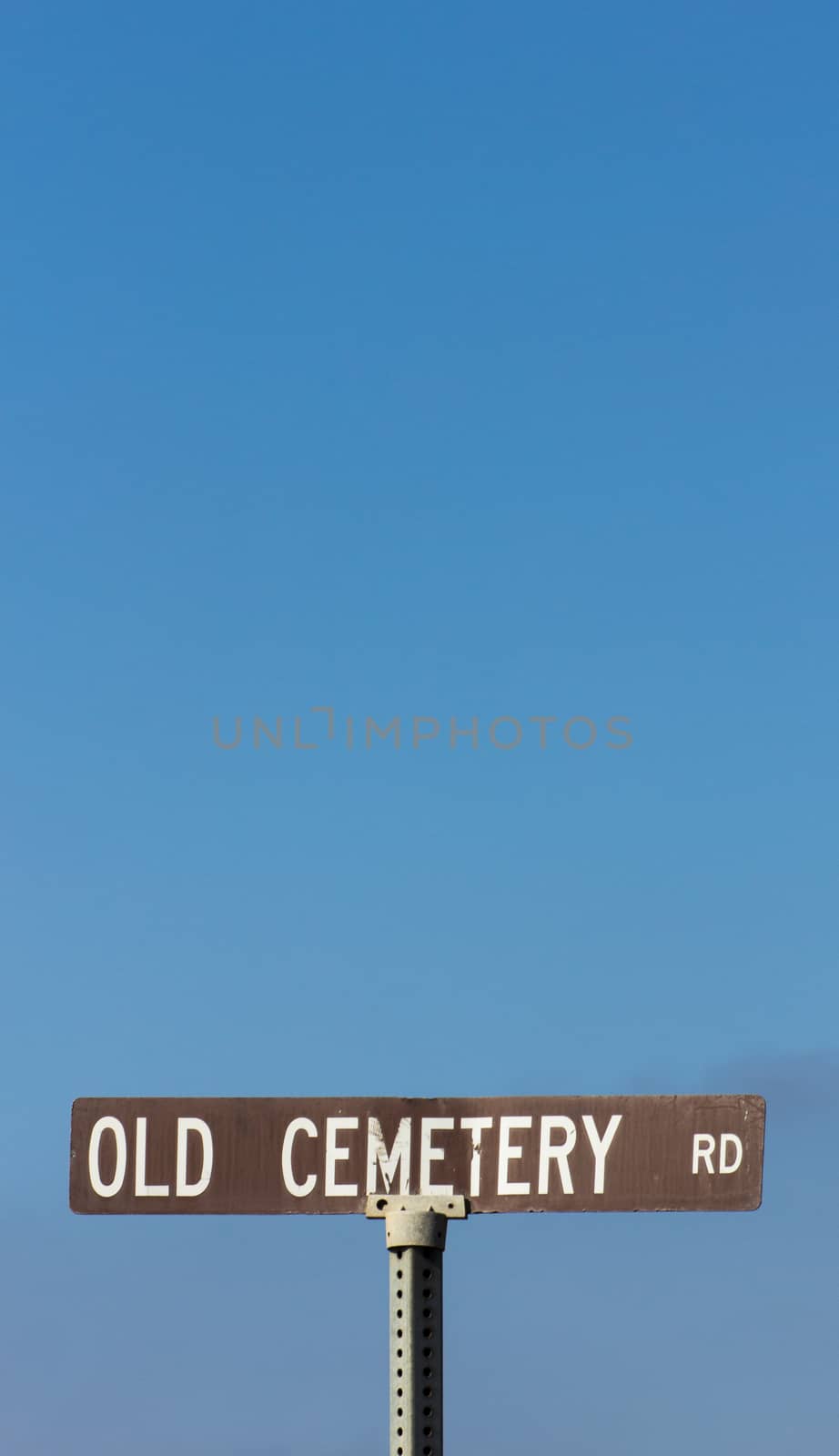 Rusty Sign to Old Cemetery Road in Vertical