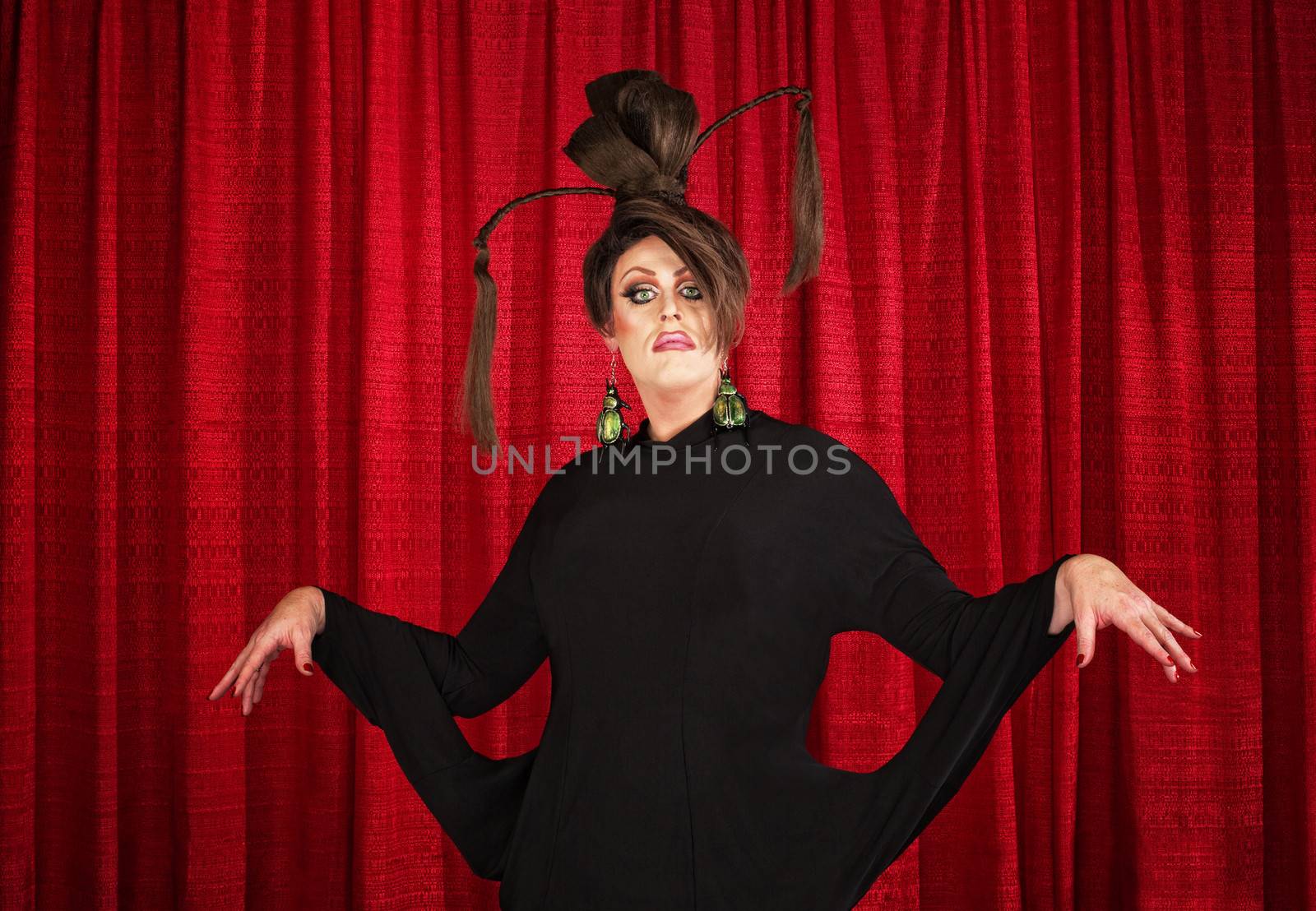 Drag queen in theater wearing unique dress