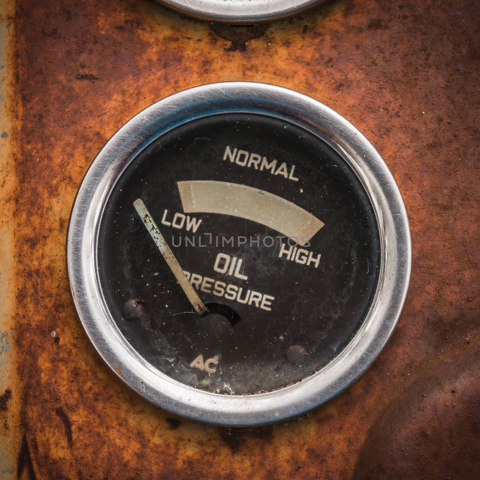 An old retro steampunk style oil pressure gauge