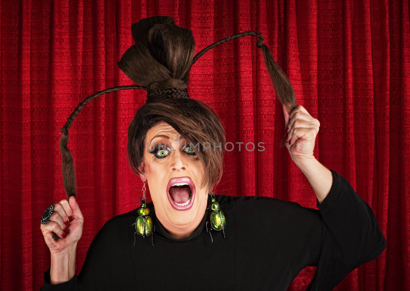 Desperate white drag queen over curtain pulling ponytails