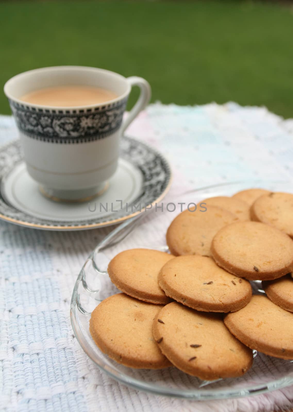 Tray full of biscuits served with tea  by haiderazim