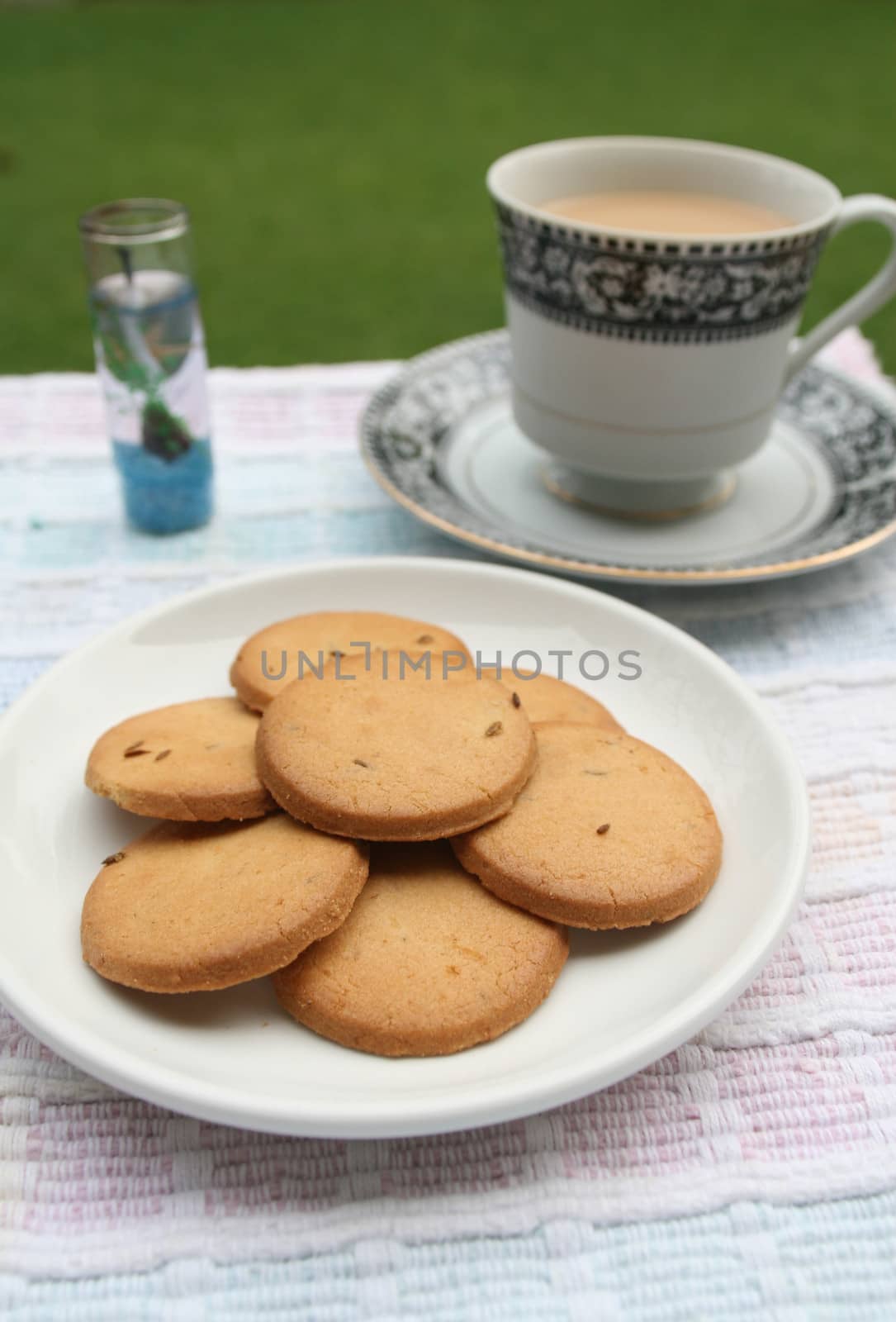 Morning tea outdoor with biscuits by haiderazim