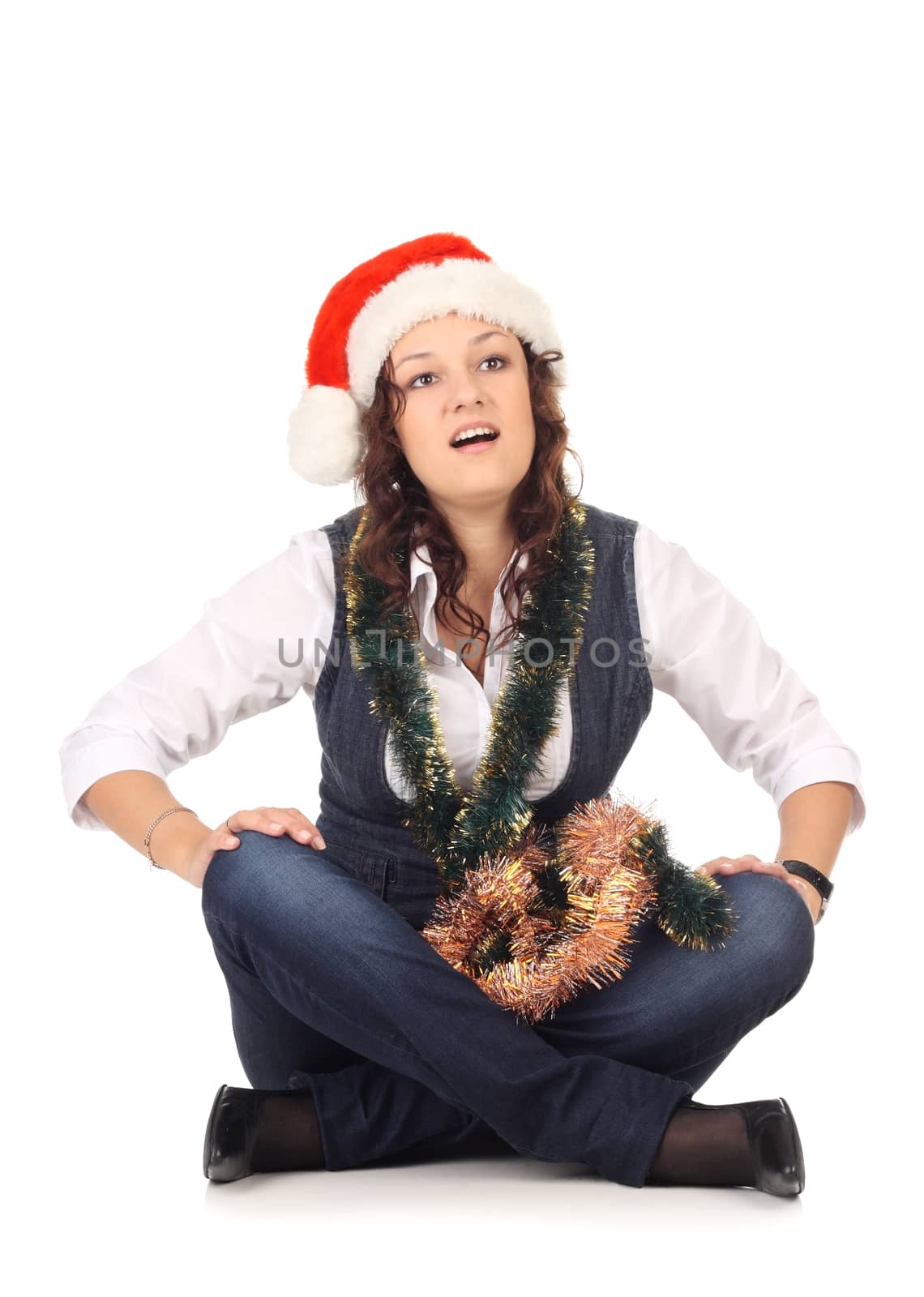 Girl in a santa hat with christmas decoration isolated at the white