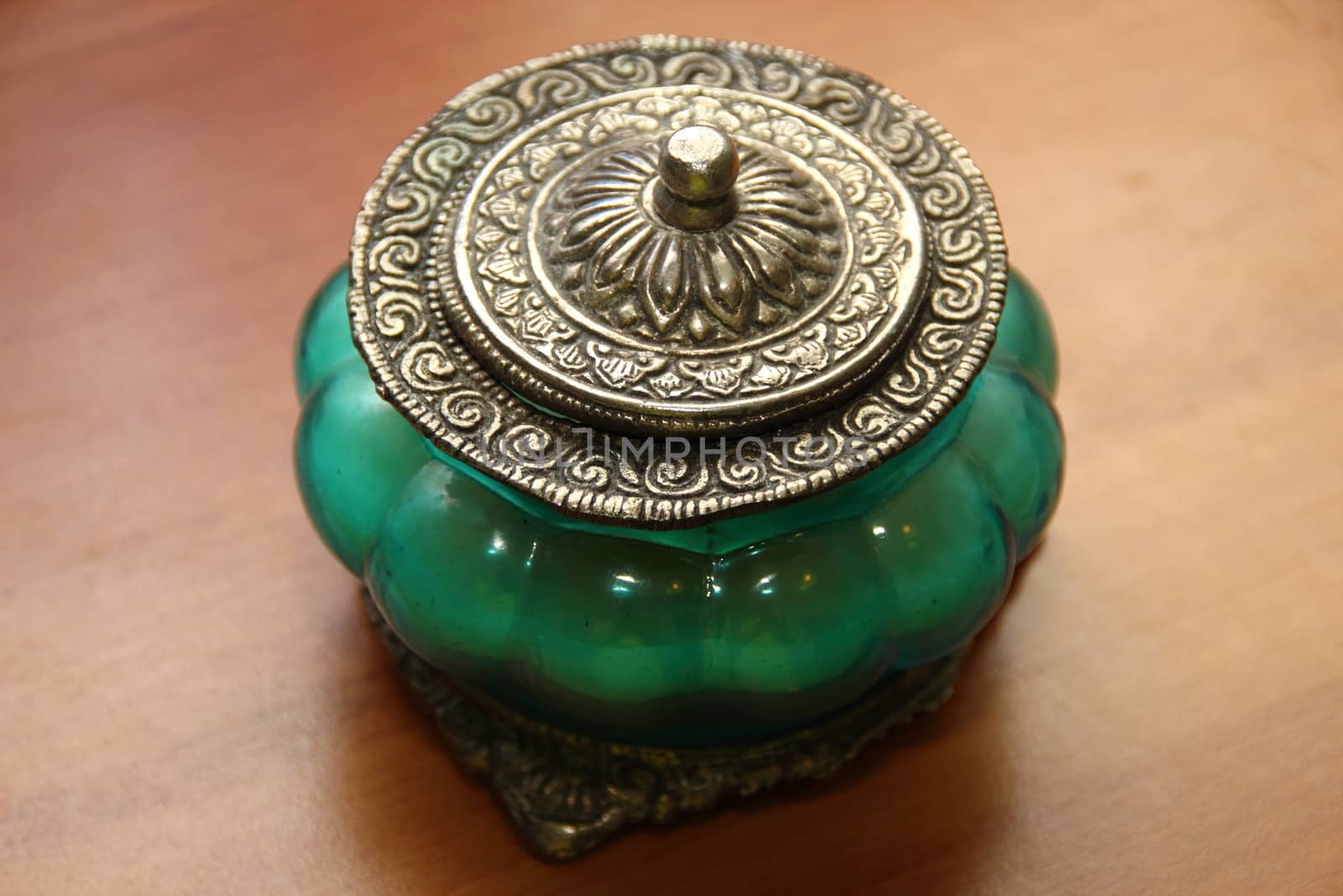 Beautiful vase, candle in oriental style. Blue and green tint