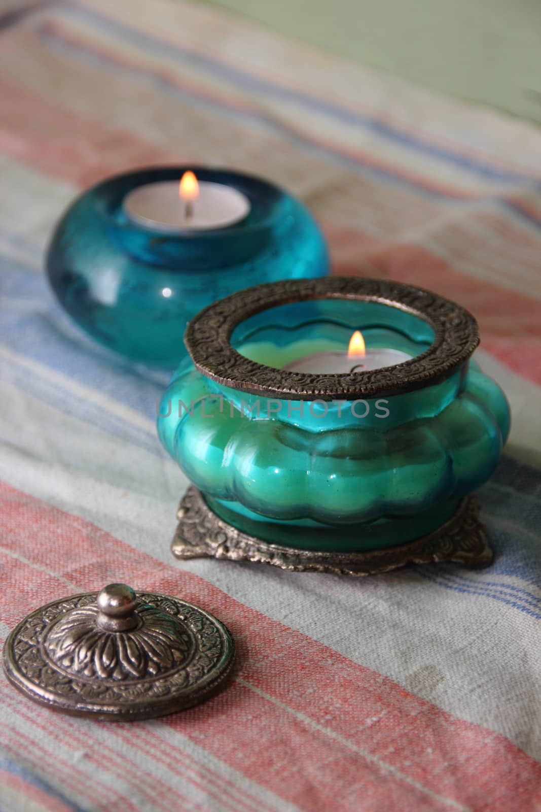 Beautiful vase, candle in oriental style. Blue and green tint