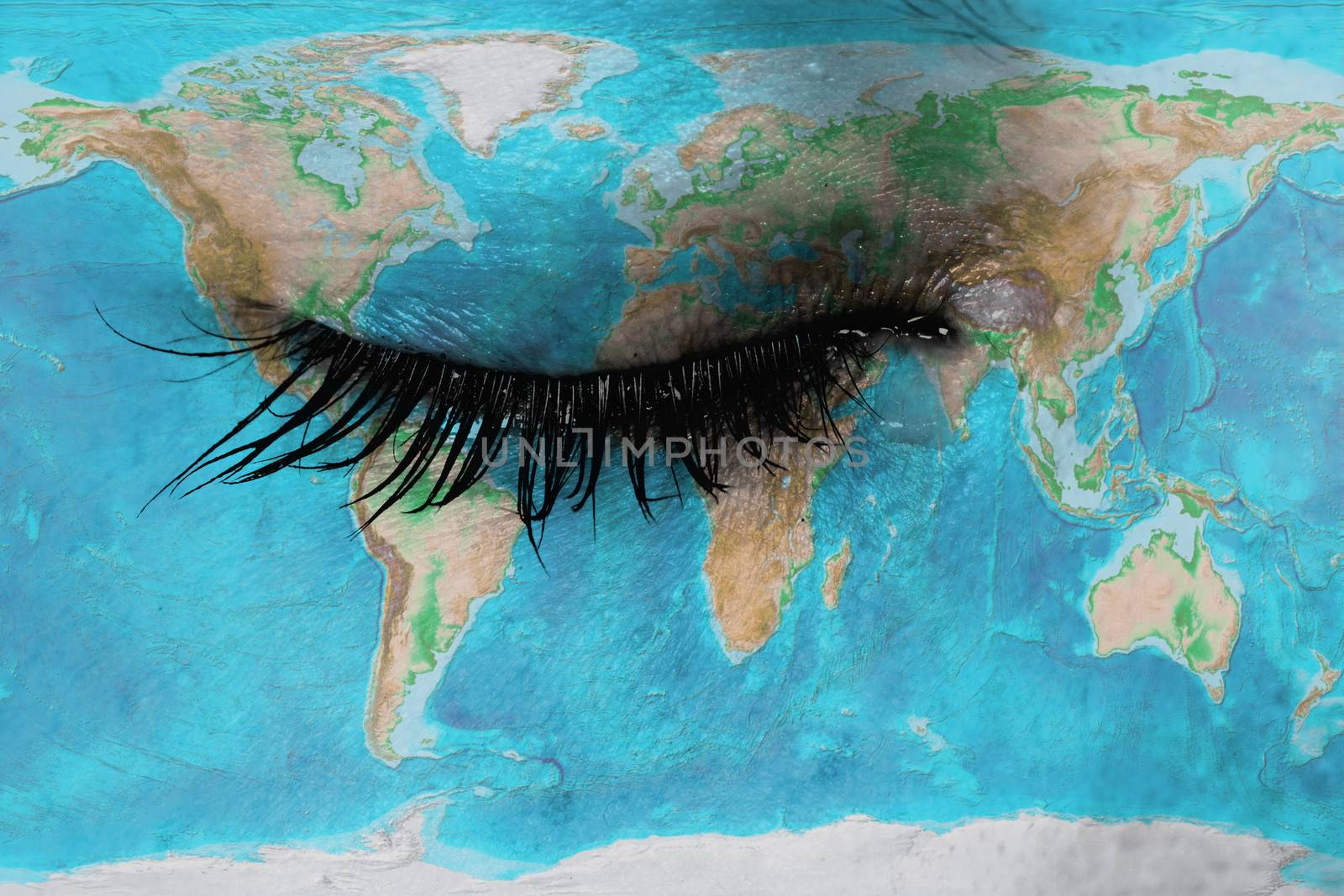 Women eye, close-up, concept of sadness, world map
