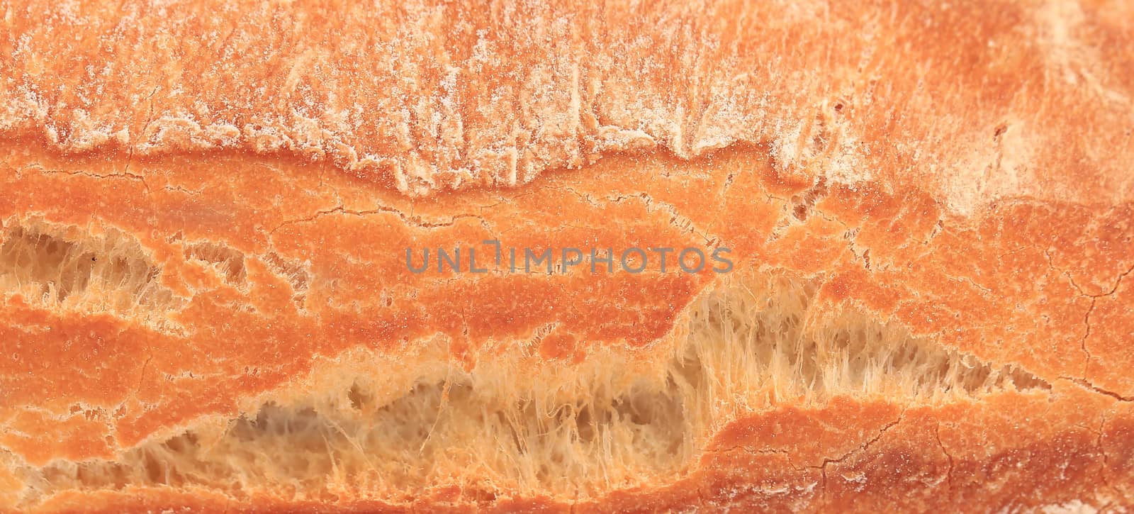 Crackling white bread. Close up. Whole background.