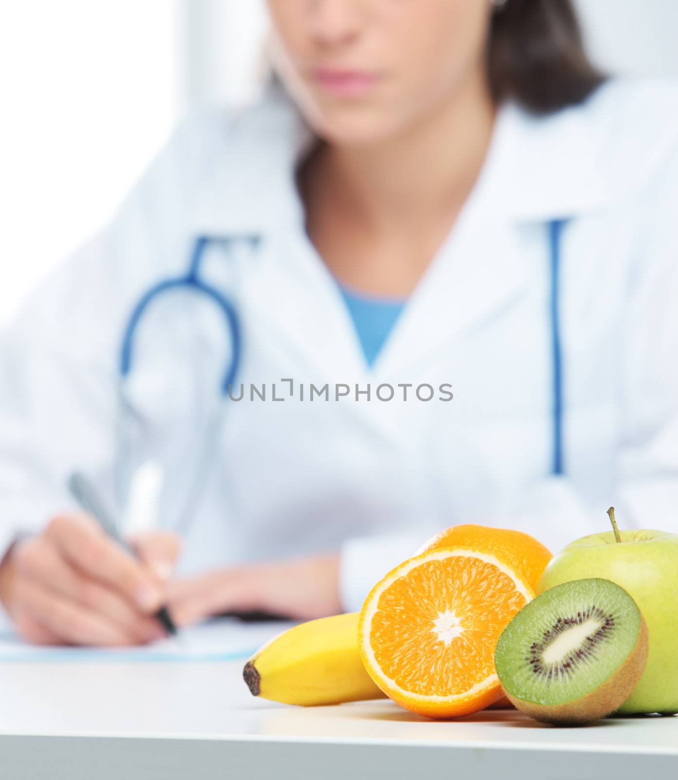 Nutritionist Doctor is writing a prescription. Focus on fruit