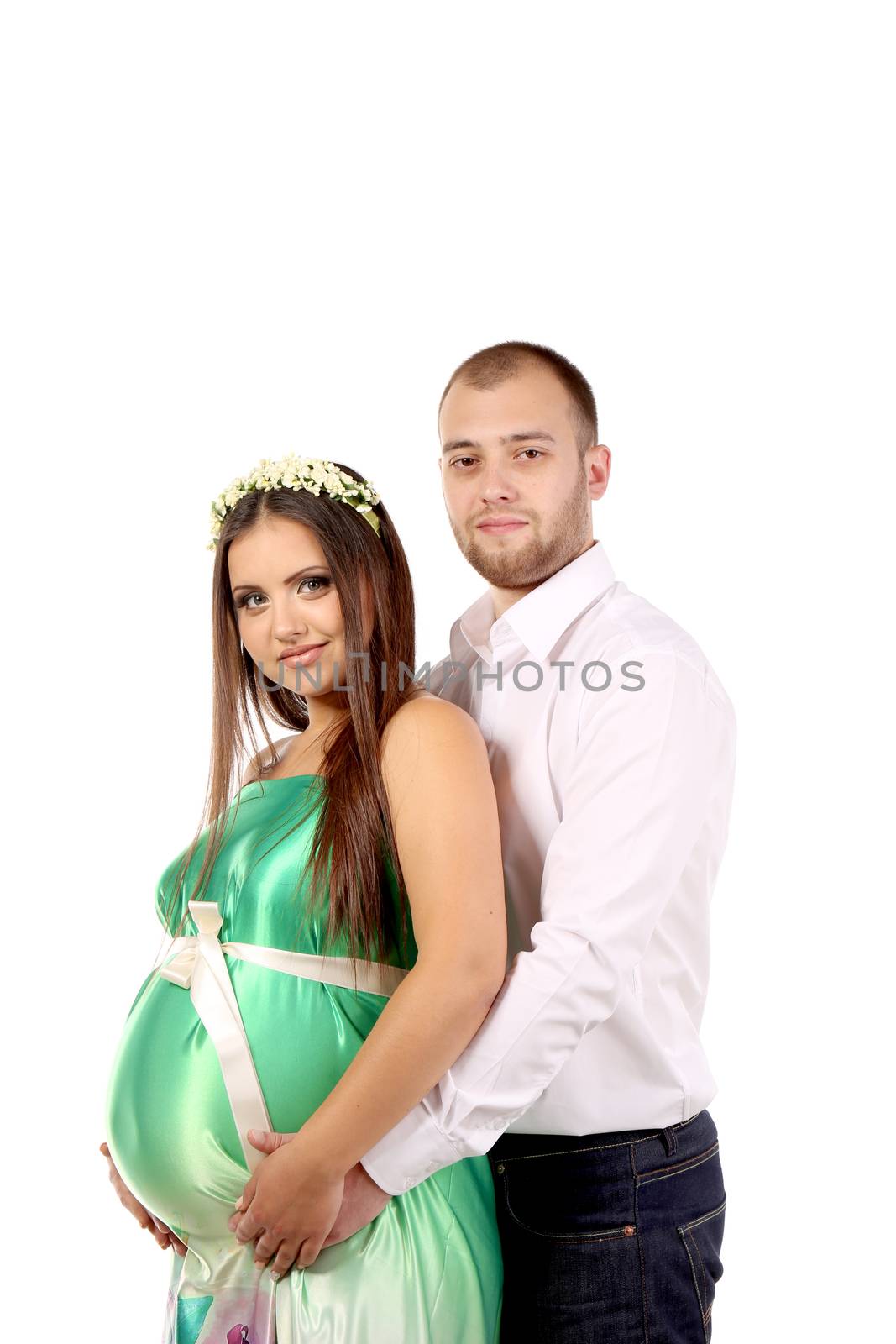 Happy couple expecting baby. Isolated on a white background.