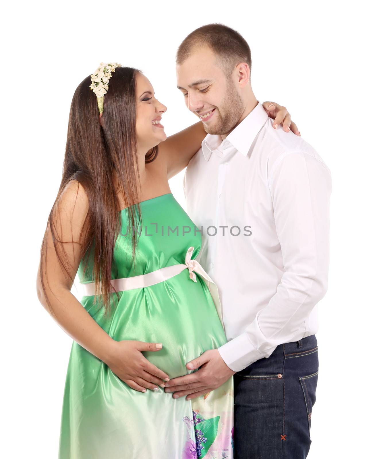 Happy couple expecting baby. Isolated on a white background.