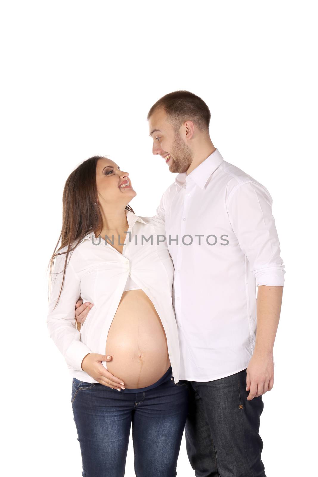 Laughing couple expecting baby. Isolated on a white background.