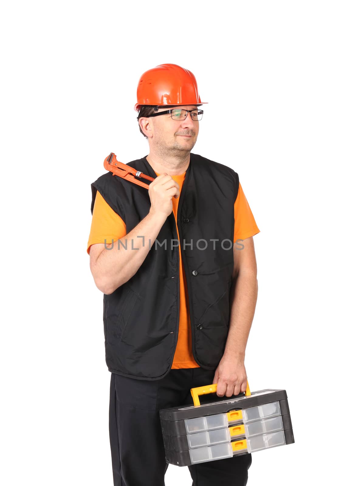 Man in workwear and red hard hat with tool box. by indigolotos