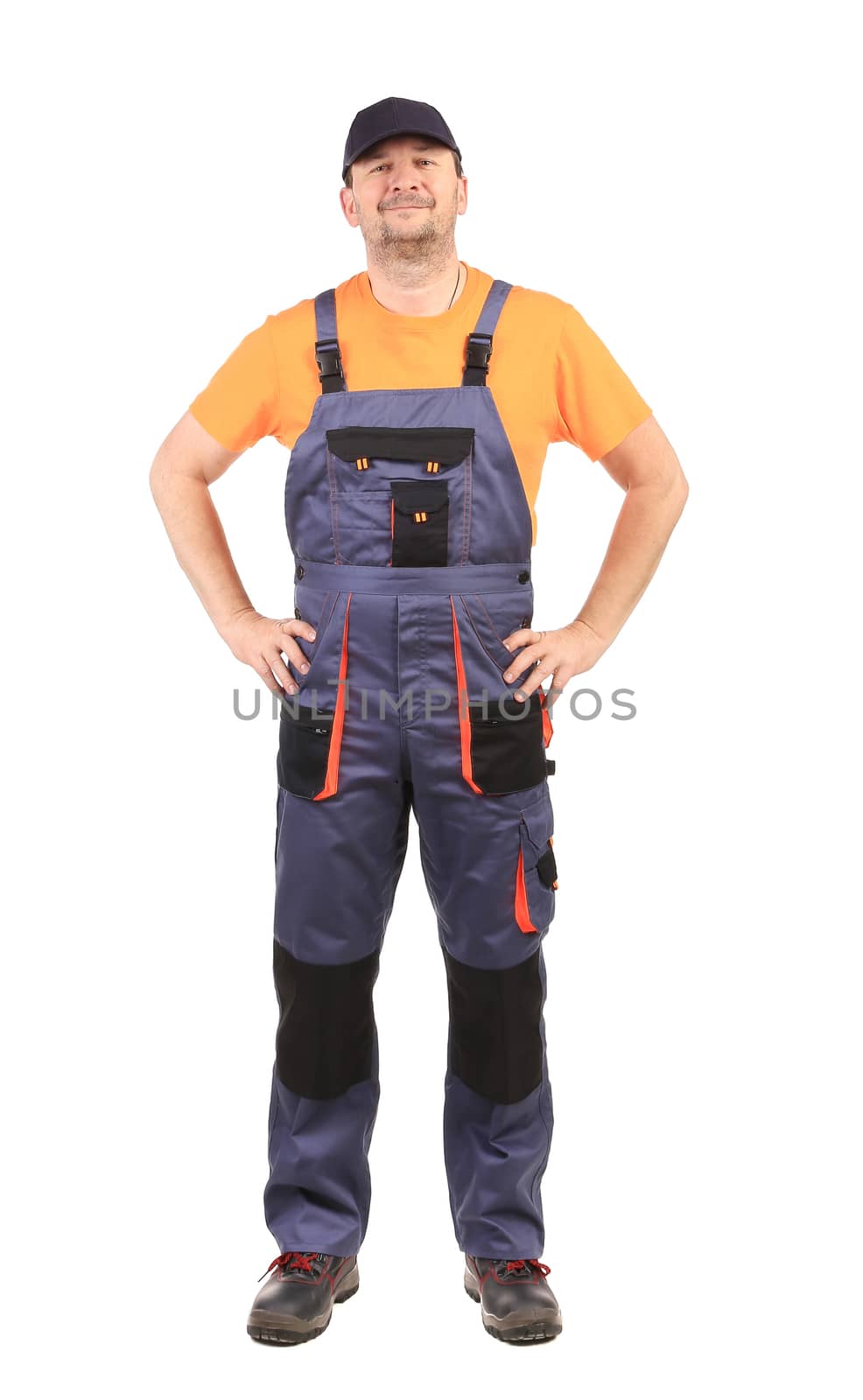 Happy worker wearing overalls. Isolated on a white background.