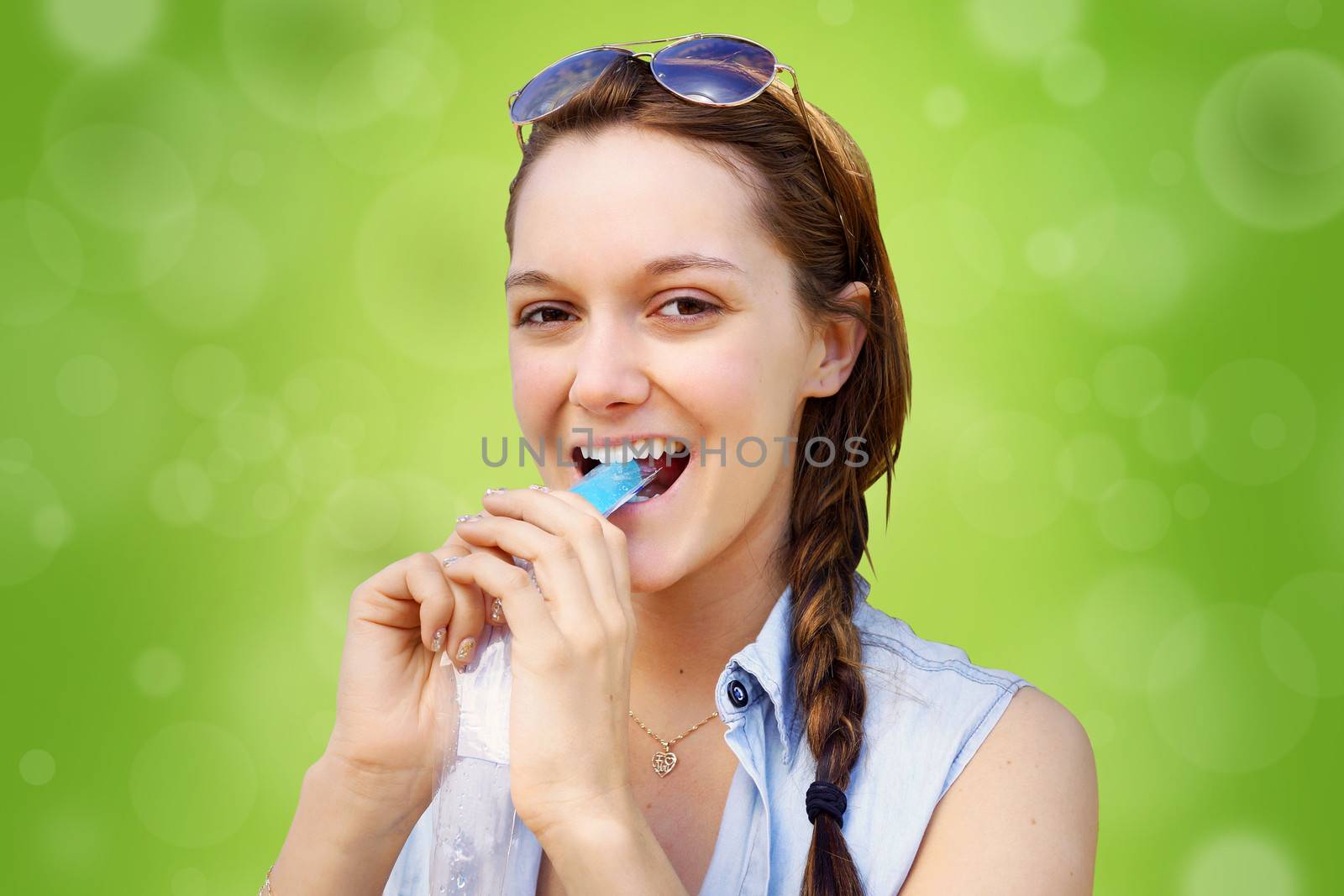 Young woman eating frozen treat by Mirage3
