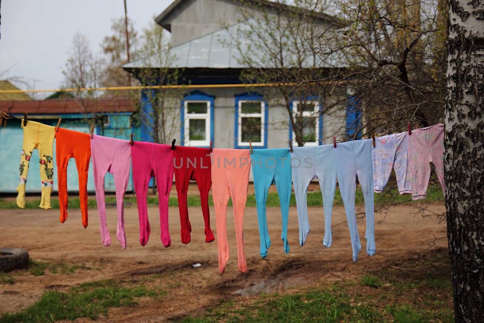 colorful children's stockings hanging on a rope