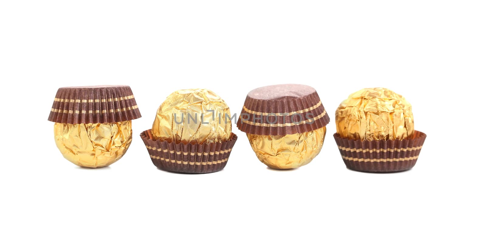 Four in row chocolate bonbons. Isolated on a white background.
