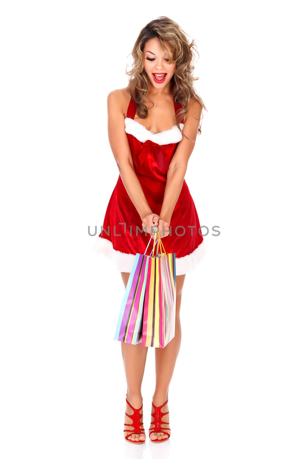 Surprised girl with shopping bag, white background, copyspace