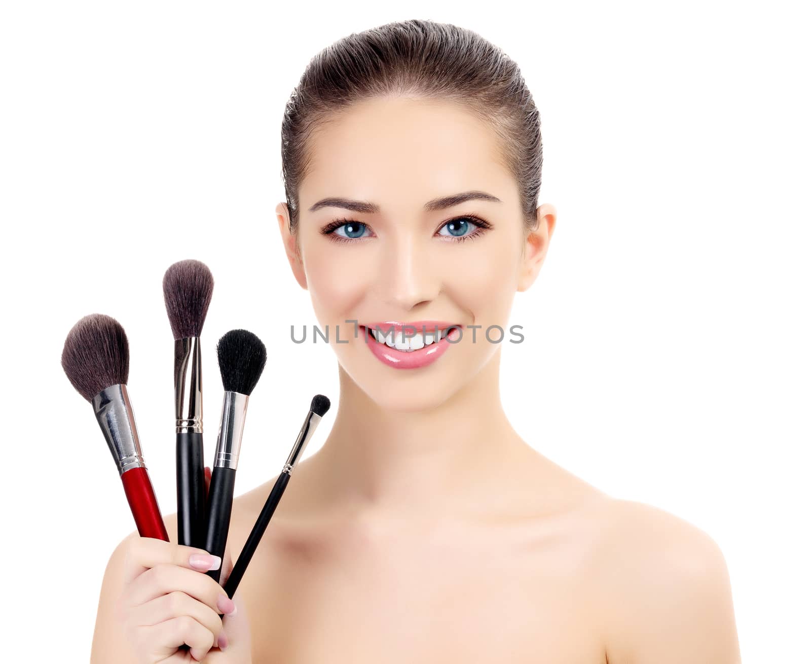 Female with cosmetic brushes, white background, copyspace by Nobilior