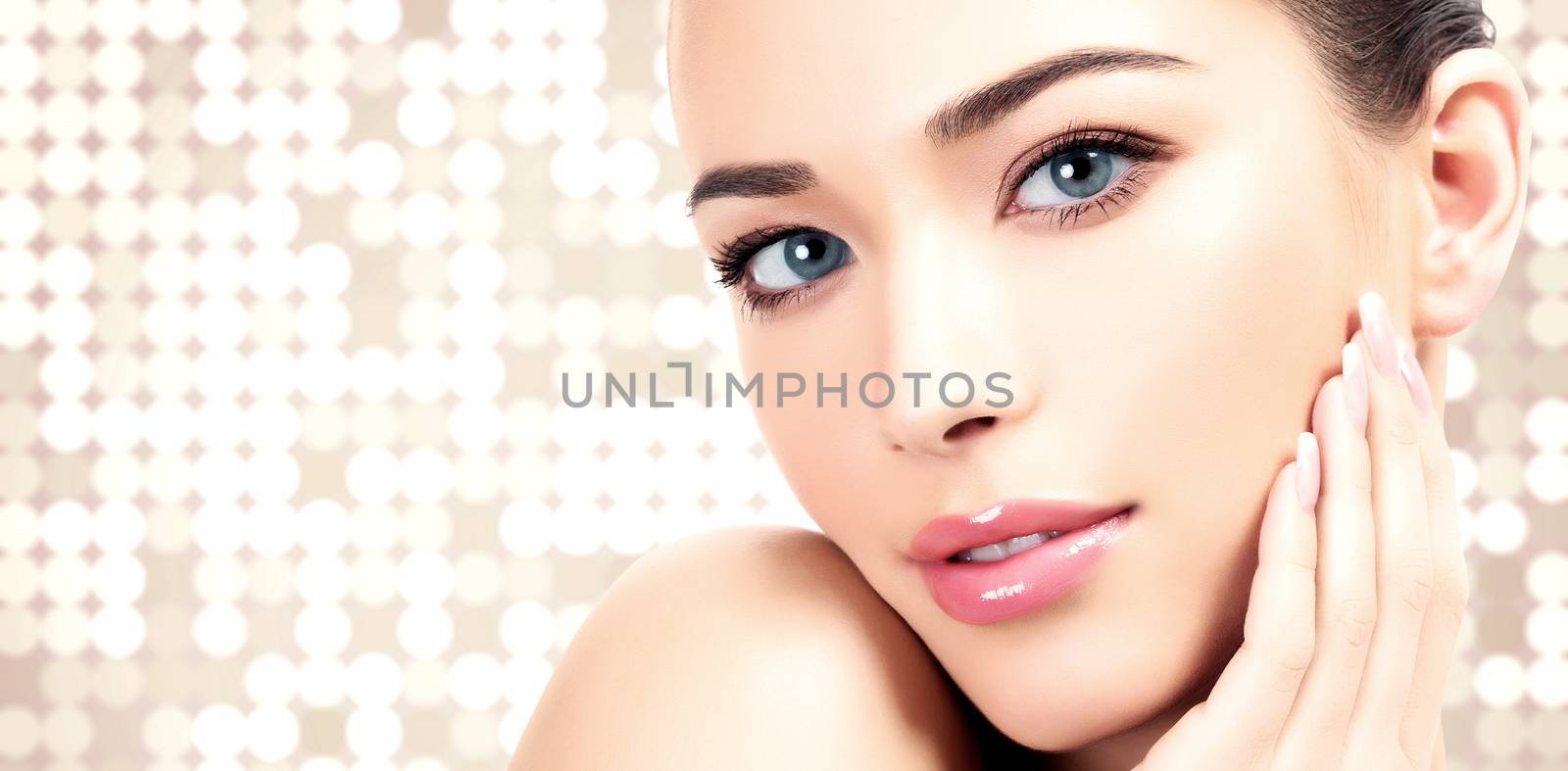 Pretty woman against an abstract background with circles and copyspace.