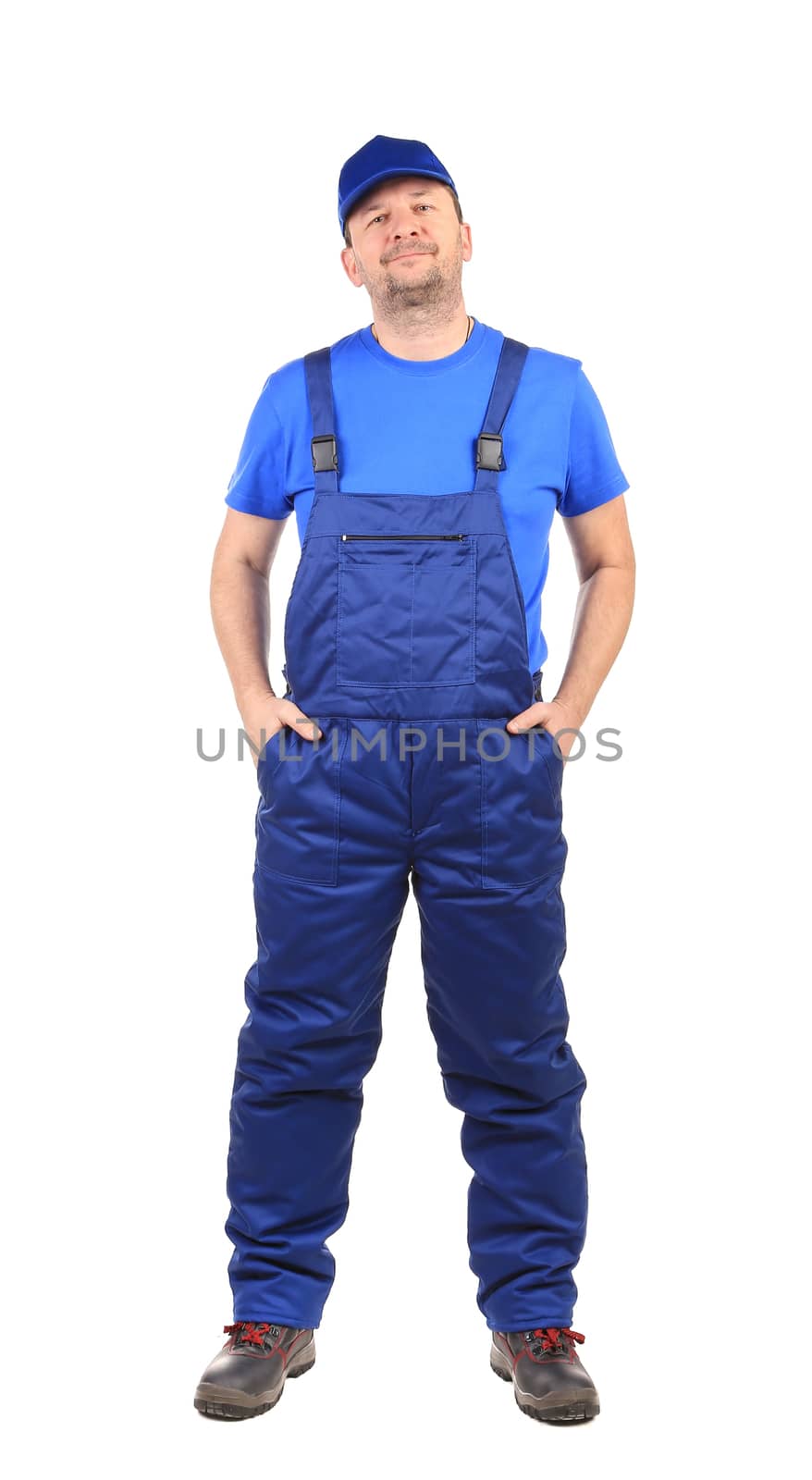 Worker with arms in pockets. Isolated on a white background.