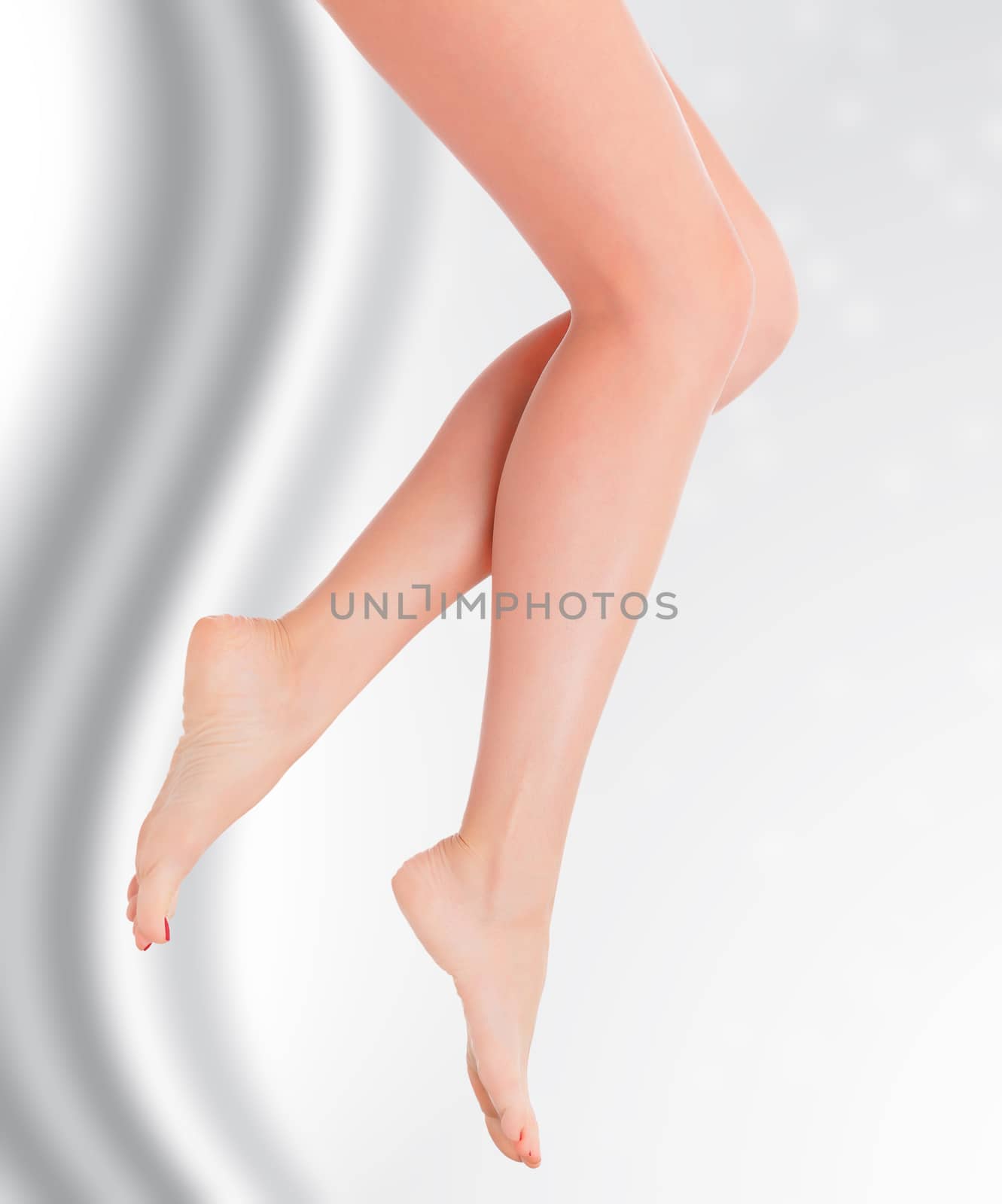 Female legson grey blurred background with a space for your text