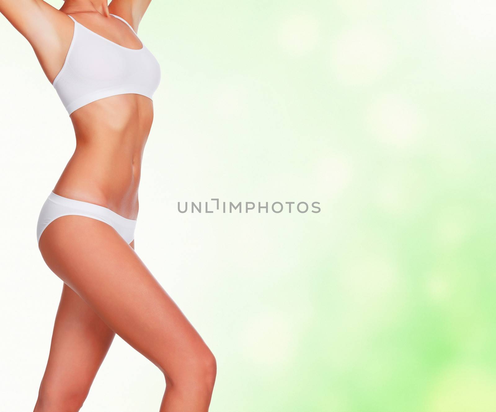 Slim woman against abstract background with circles and copyspac by Nobilior