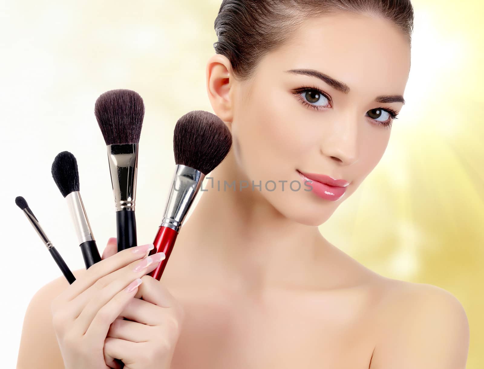 Pretty woman with cosmetic brushes by Nobilior