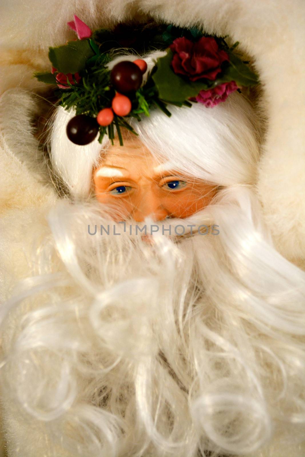 Santa Claus stares out from behind beard